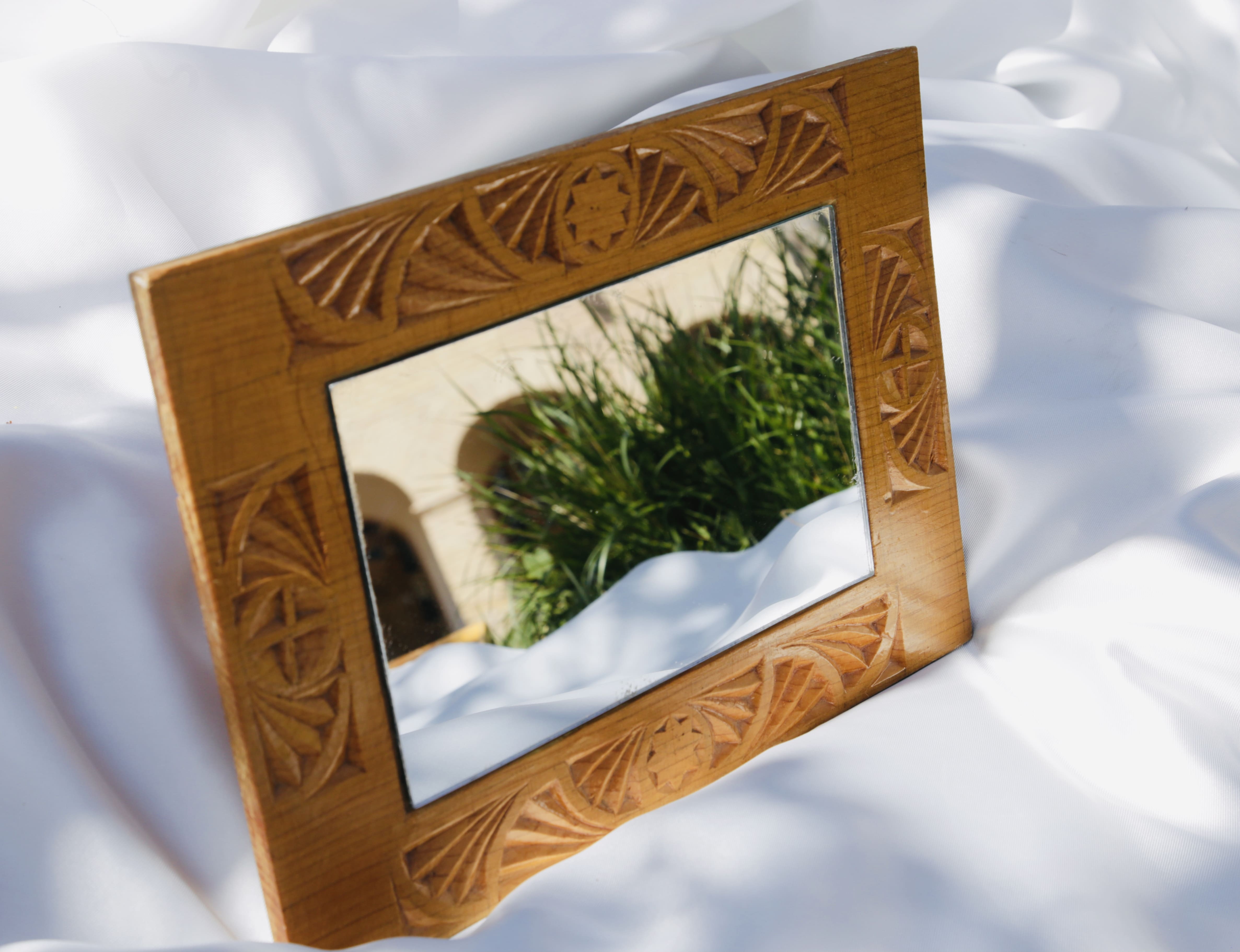 Carved wooden framed mirror