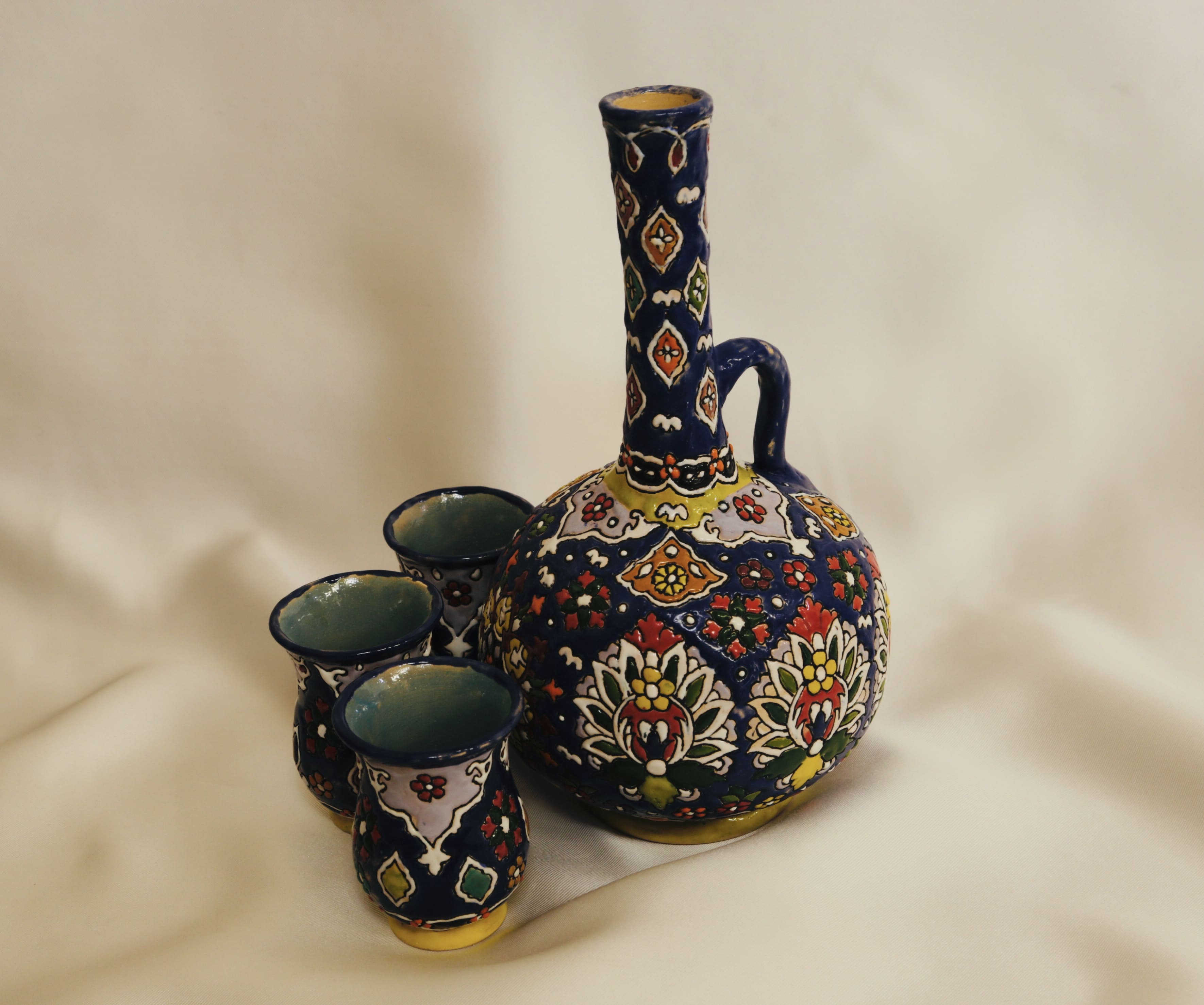 Enameled pottery pitcher