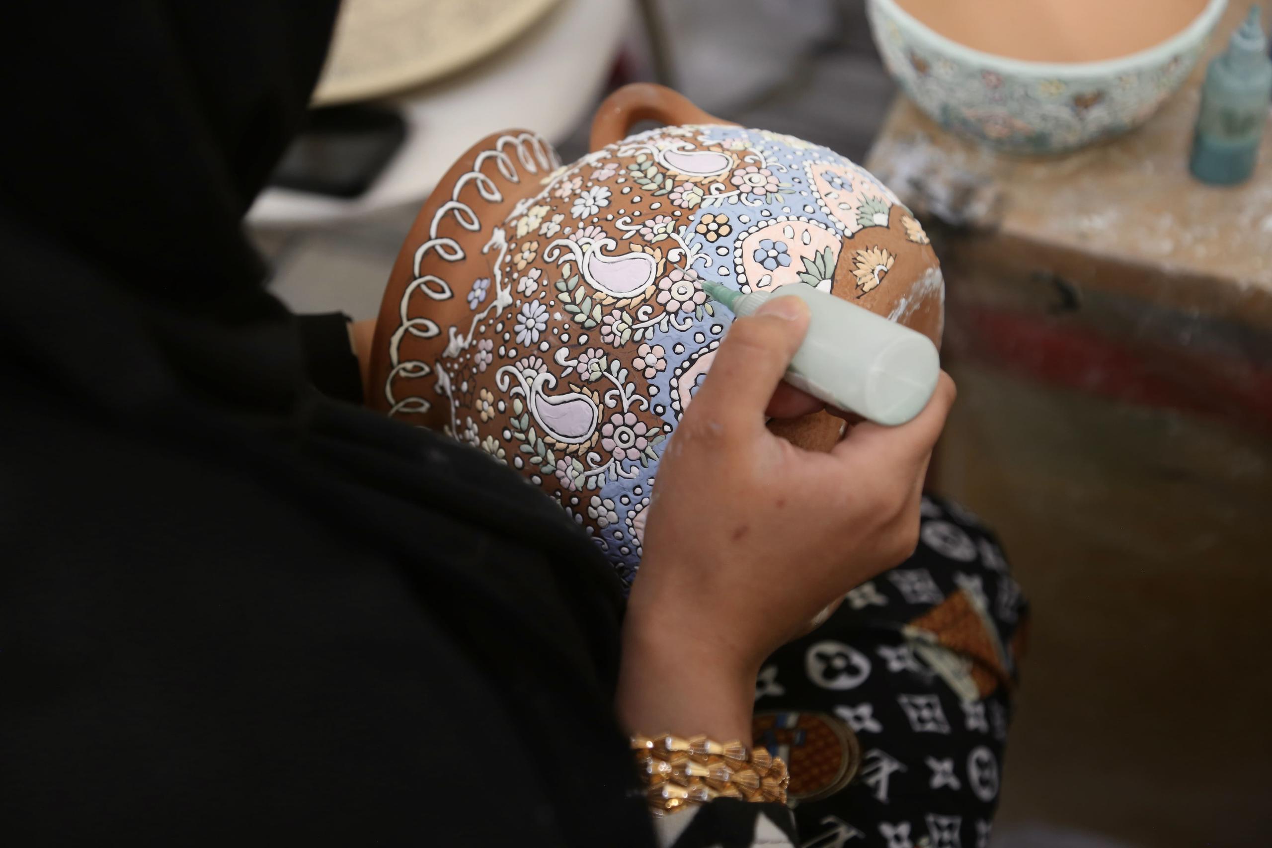 Women creating traditional crafts